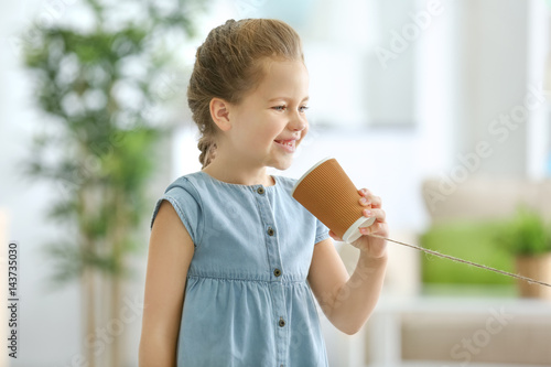 Cute little girl using plas...