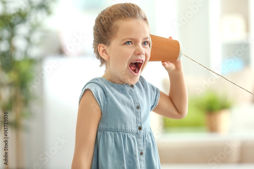 Cute little girl using plas...