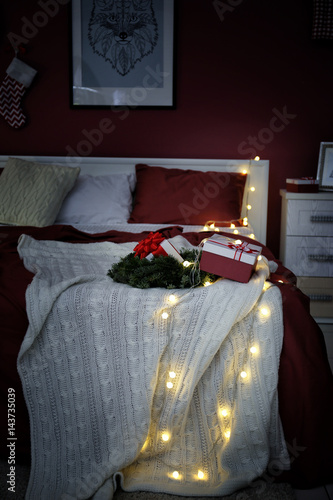 Giftboxes on bed in beautif...