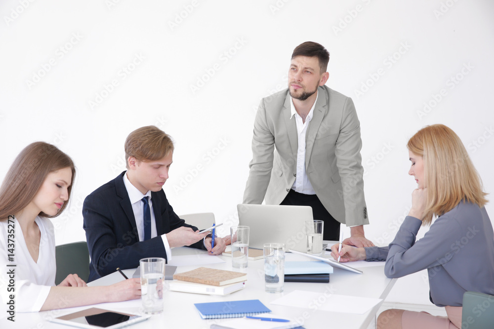 Business trainer giving presentation to group of people Business trainer giving presentation to group of people