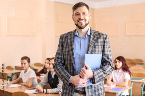Portrait of happy teacher i...