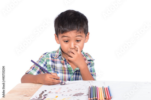 Cute little boy painting on book drawing