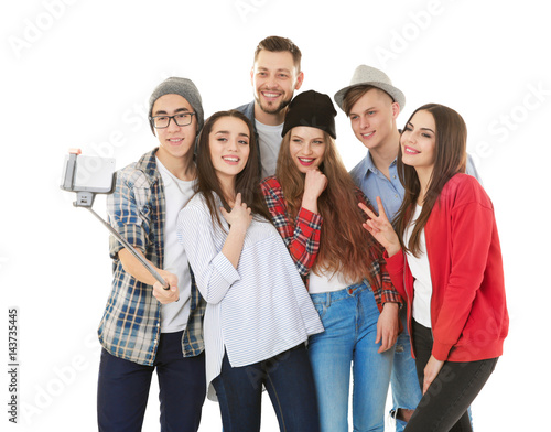 Happy young friends taking ...