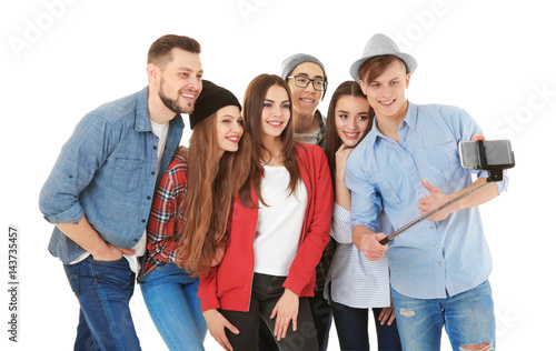 Happy young friends taking ...