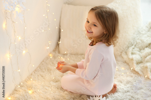 Cute little girl playing wi...