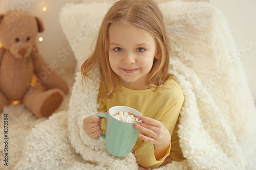 Cute little girl drinking h...