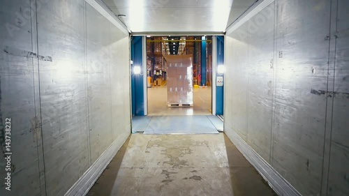 Forklift loader load boxes into a truck