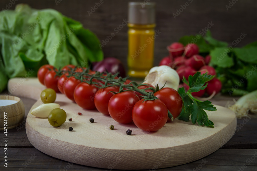Fresh cherry tomatoes on a kitchen board Fresh cherry tomatoes on a kitchen board