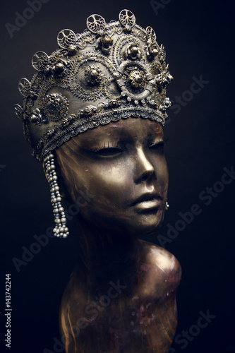 Female statue in head decoration