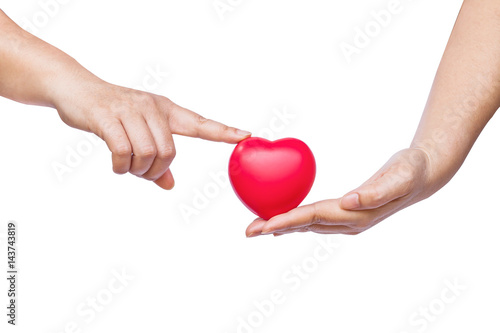 hand holding a red heart on white background