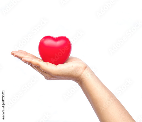 hand holding a red heart on white background