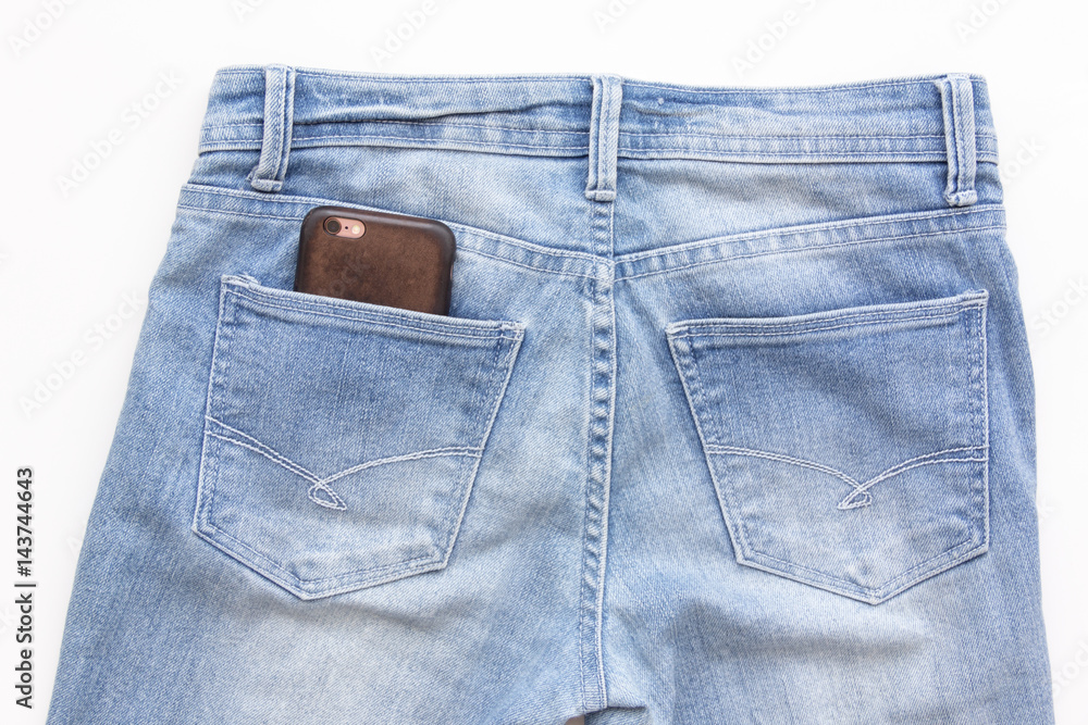 phone in back pocket of blue jeans isolated on white phone in back pocket of blue jeans isolated on white