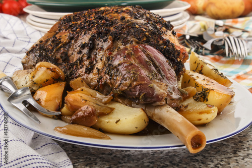 grilled leg of lamb with rosemary, potato and onion
