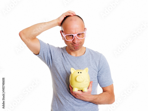 man in gray shirt with pink glasses and piggybank photo