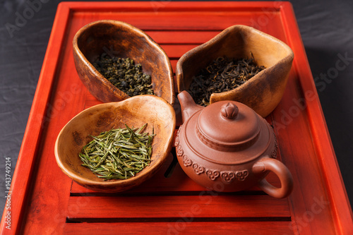 Set of teapot and three kinds of tea in chahe photo