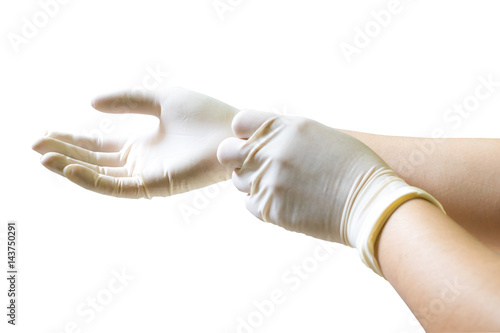 Doctor putting on sterile gloves isolated on white background