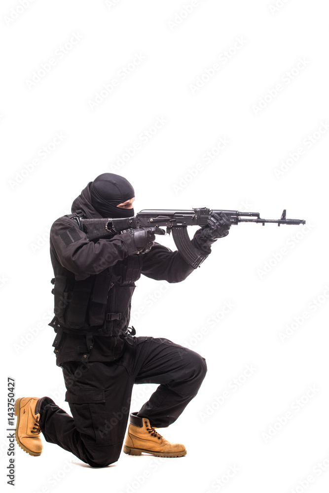 Fototapeta premium Terrorist with weapon on a white