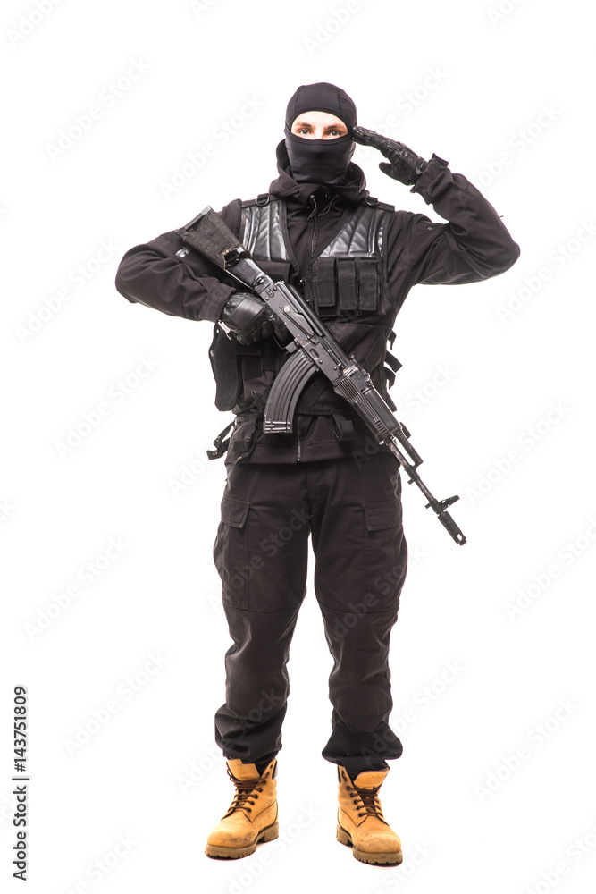 Portrait of soldier holding a rifle and saluting Portrait of soldier holding a rifle and saluting