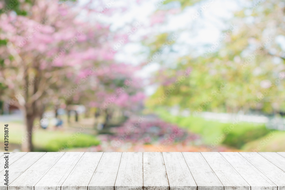 Wood table top and blurred flower tree in garden background with vintage  filter Stock Photo | Adobe Stock