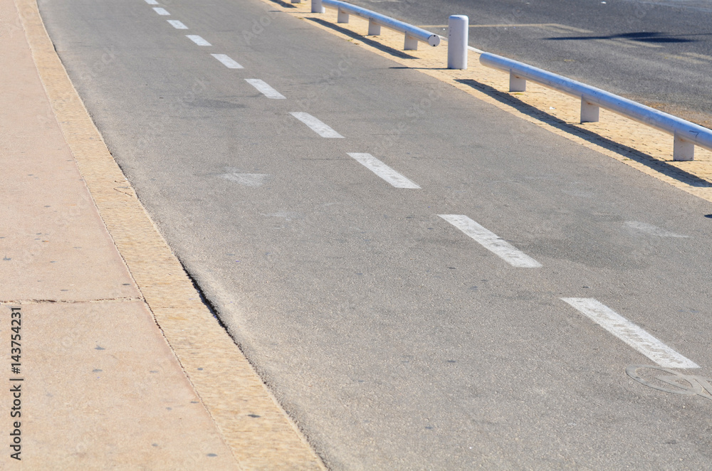 The asphalt road with white marking