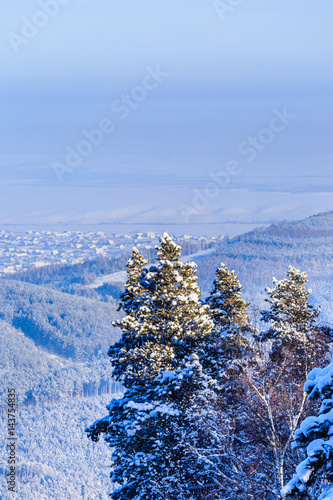 View from Tserkovka mountain to the resort town of Belokurikha in winter, Altai, Russia photo