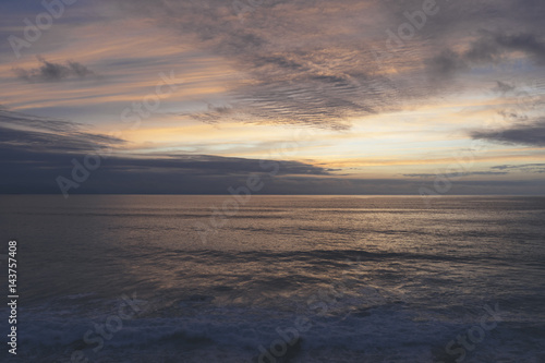 Clouds sky and sunlight gold sunset on horizon ocean. Background seascape dramatic atmosphere rays sunrise. Relax view waves water sea, mock up nature evening concept perspective sunrise © A_B_C