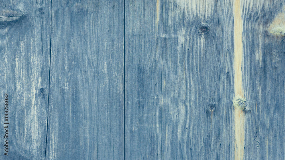 Old blue wooden wall, detailed background photo texture. Wood plank fence close up. Retro color style.