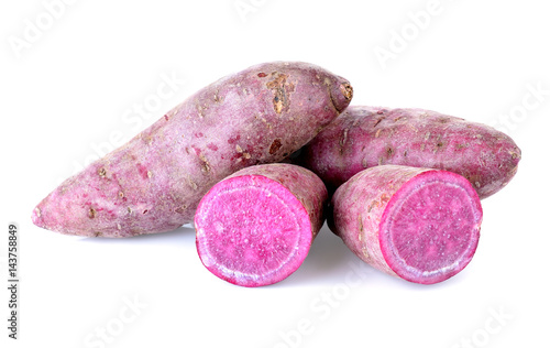 sweet purple potatoes on white background