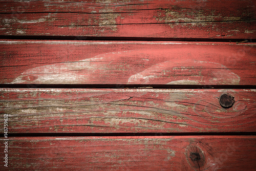 Obraz na płótnie Old wooden wall painted in red color, detailed background photo texture. Wood plank fence close up. w salonie