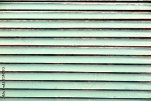 green background with striated planks