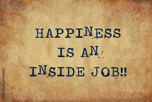 Inspiring motivation quote of happiness is an inside job with typewriter text. Distressed Old Paper with Typing image. photo
