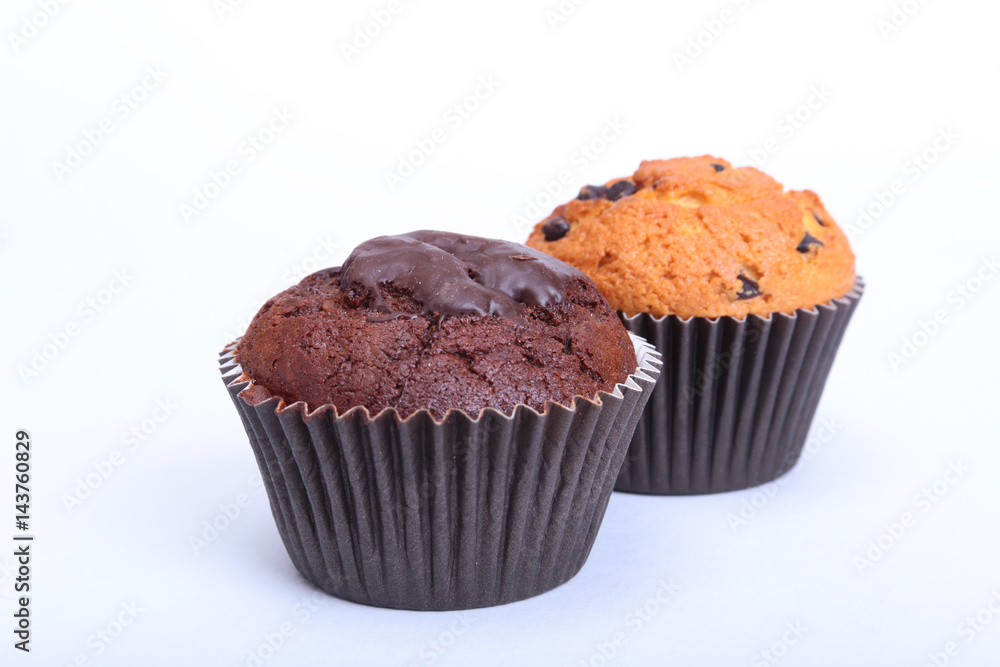 Fresh homemade muffins on white background. Top view.