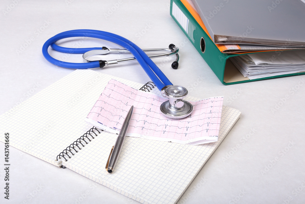 Folder file, stethoscope and RX prescription on the desk. blurred background. Folder file, stethoscope and RX prescription on the desk. blurred background.