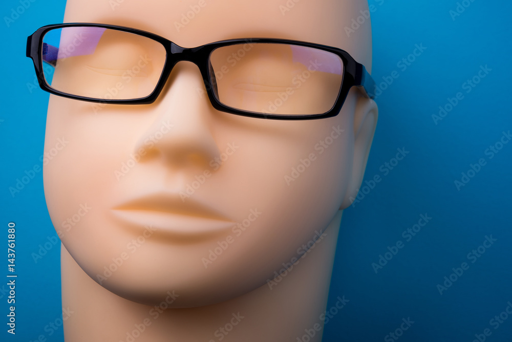 mannequin head with black eyeglasses on background mannequin head with black eyeglasses on background