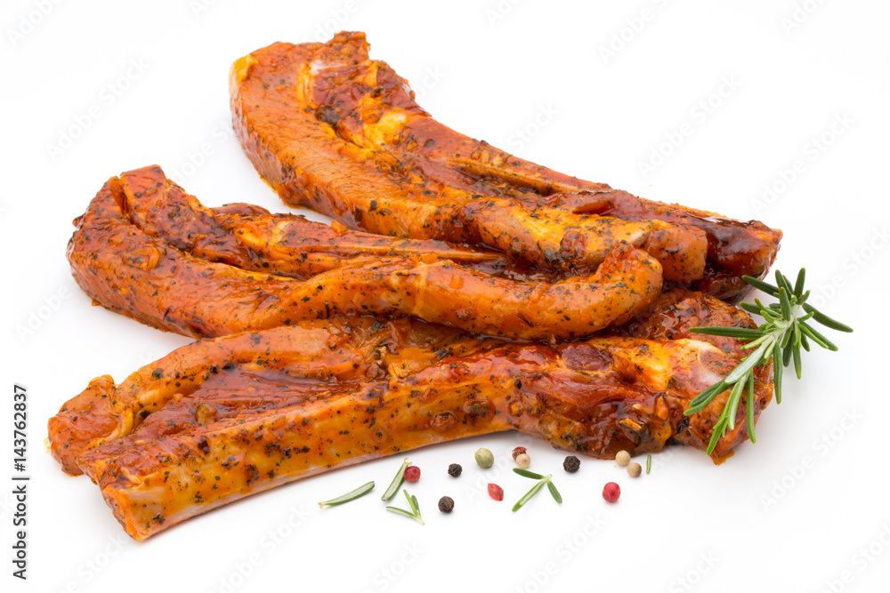 Spicy marinated spare ribs barbecued on the white background. Spicy marinated spare ribs barbecued on the white background.