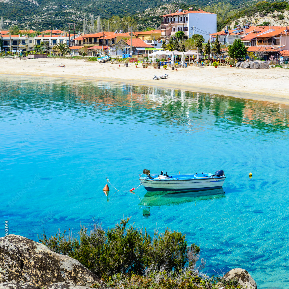 Boat on Kalamitsi beach. Kalamitsi is a romantic gateway for families, couples and adventurers. Location: Sitonia, Halkidiki, Macedonia, Northern Greece.