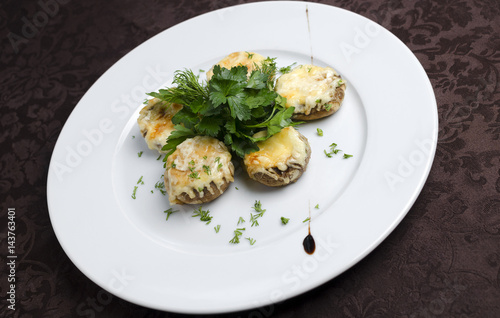 Baked mushrooms on a white plate