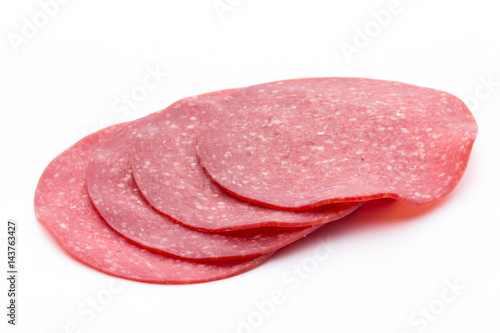Salami smoked sausage one slice isolated on white background cutout.