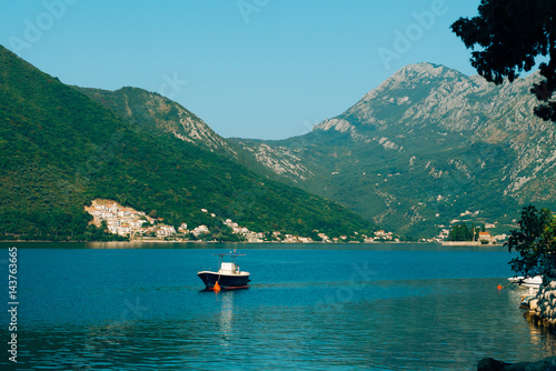 Boat in the Bay of Kotor. Montenegro, the water of the Adriatic Sea. Boats, yachts, liners.