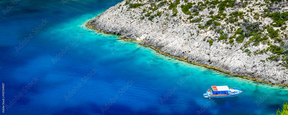 Boats and turquoise water in the blue lagoon of Porto Vromi, Zakynthos (Zante) Island, Greece