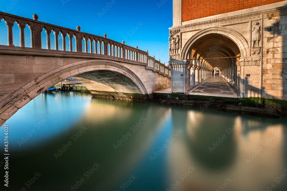 Bridge, Canal and Doge's Palace Illuminated by Rising Sun at Sunrise, Venice, Italy