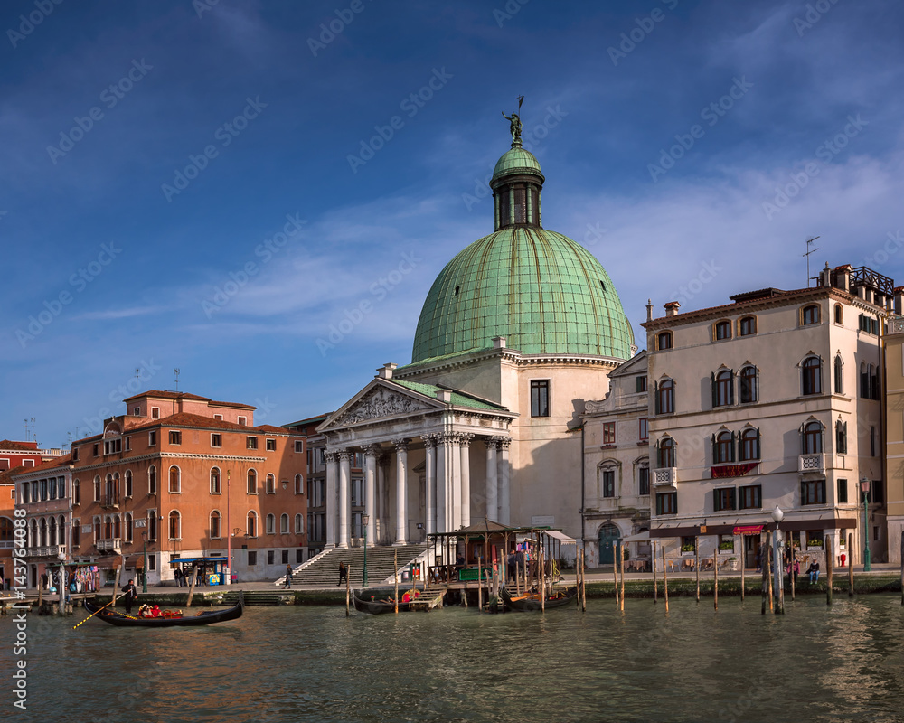 Grand Canal and Gondola Passing Chiesa de San Simeone Piccolo in Venice, Italy