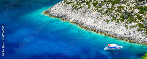 Obraz na płótnie Boats and turquoise water in the blue lagoon of Porto Vromi, Zakynthos (Zante) Island, Greece w salonie