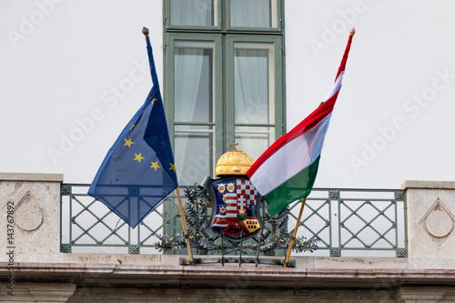 Photography National hungarian and Europe Union flags on presidential palace entrance in Bud