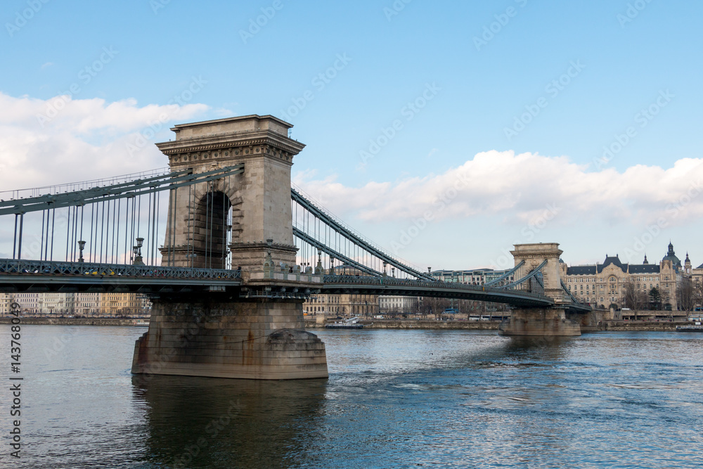 Obraz premium The Szechenyi Chain Bridge over Danube river with view to Pest side in Budapest city the capital of Hungary