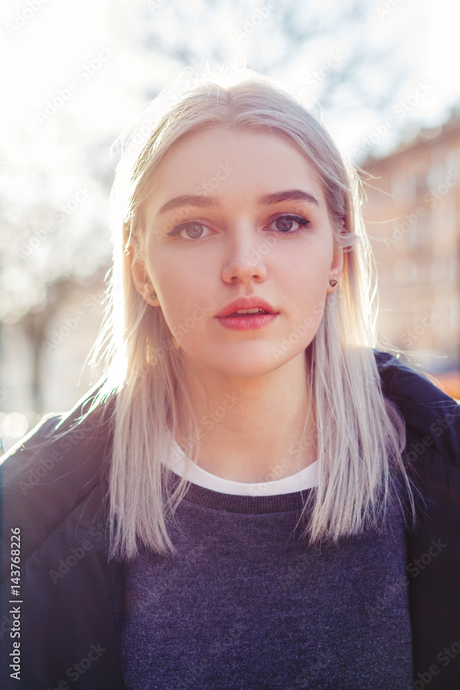 Beautiful attractive young girl in the evening in the city Beautiful attractive young girl in the evening in the city