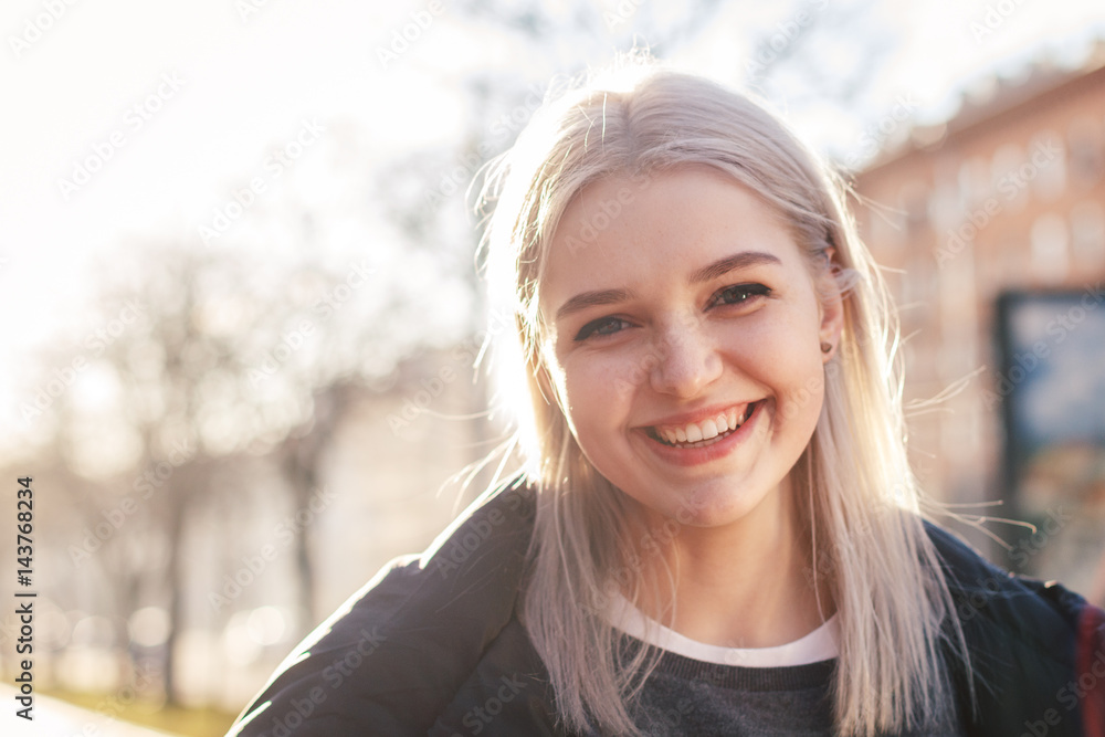 Beautiful attractive young girl in the evening in the city Beautiful attractive young girl in the evening in the city