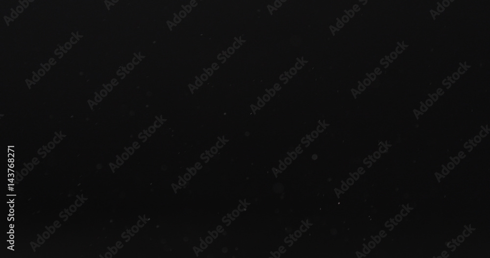 dust particles fast moving over black background from right, 4k photo dust particles fast moving over black background from right, 4k photo