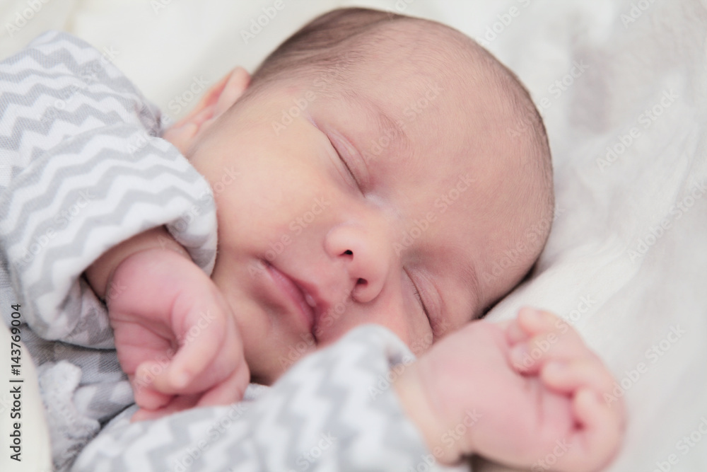 Cute newborn baby sleeping, face closeup Cute newborn baby sleeping, face closeup