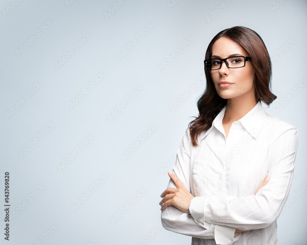 Portrait of seriously looking young businesswoman in glasses Portrait of seriously looking young businesswoman in glasses